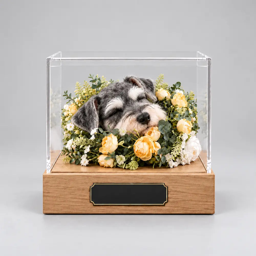Custom handcrafted pet memorial display featuring a realistic sleeping Schnauzer surrounded by yellow flowers in a clear acrylic case with wooden base.